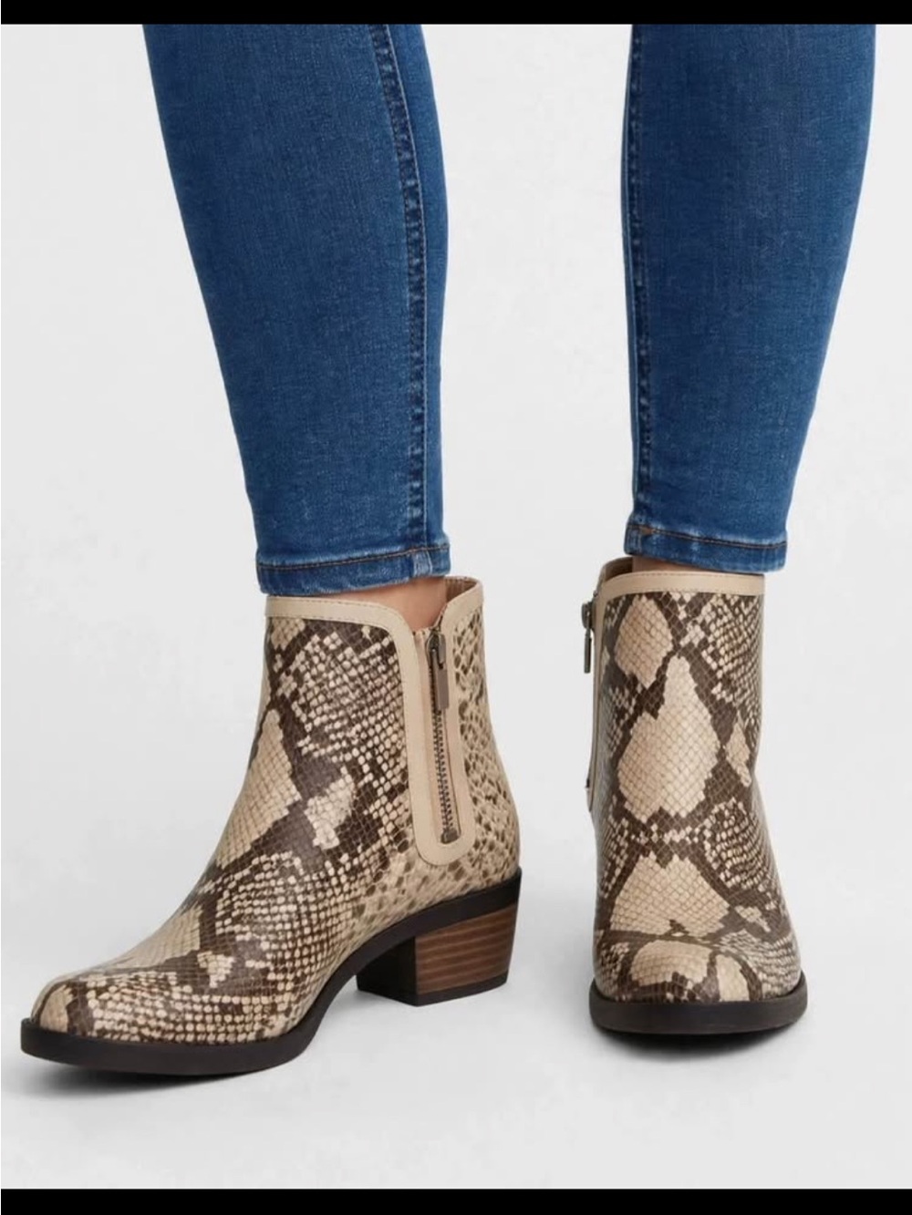 These are the Lucky Brand Basel H2O Rain Boot in a chic chinchilla snake prin